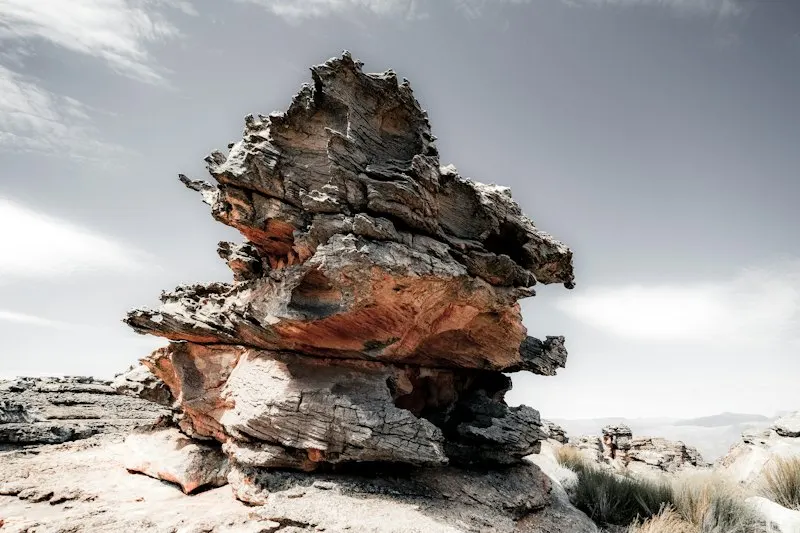 Placeholder: weathered sandstone formation under open sky